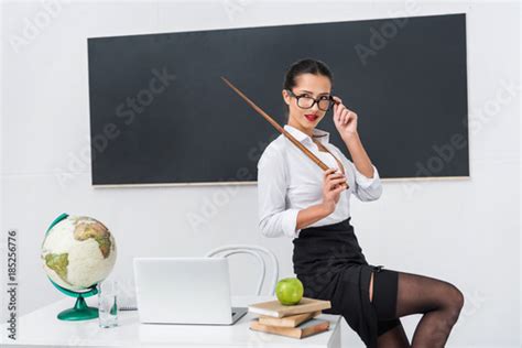 images of sexy teachers|Sexy school teacher sitting on desk Stock Photo .